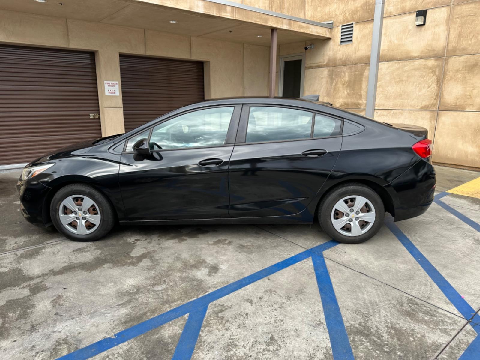 2017 Black /BLACK Chevrolet Cruze LS Auto (1G1BC5SM6H7) with an 1.4L L4 DOHC 16V TURBO engine, 6A transmission, located at 30 S. Berkeley Avenue, Pasadena, CA, 91107, (626) 248-7567, 34.145447, -118.109398 - Crown City Motors is a used “Buy Here Pay Here” car dealer in Pasadena CA. “Buy Here Pay Here” financing, means that when you purchase your vehicle from our dealership, that you make the payments to the dealership as well. We do not need the banks approval to get you approved for a used auto - Photo #1